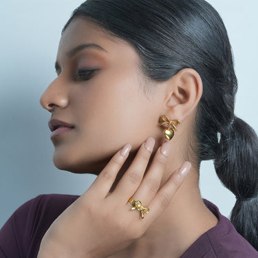 Gold heart bow earring and rings